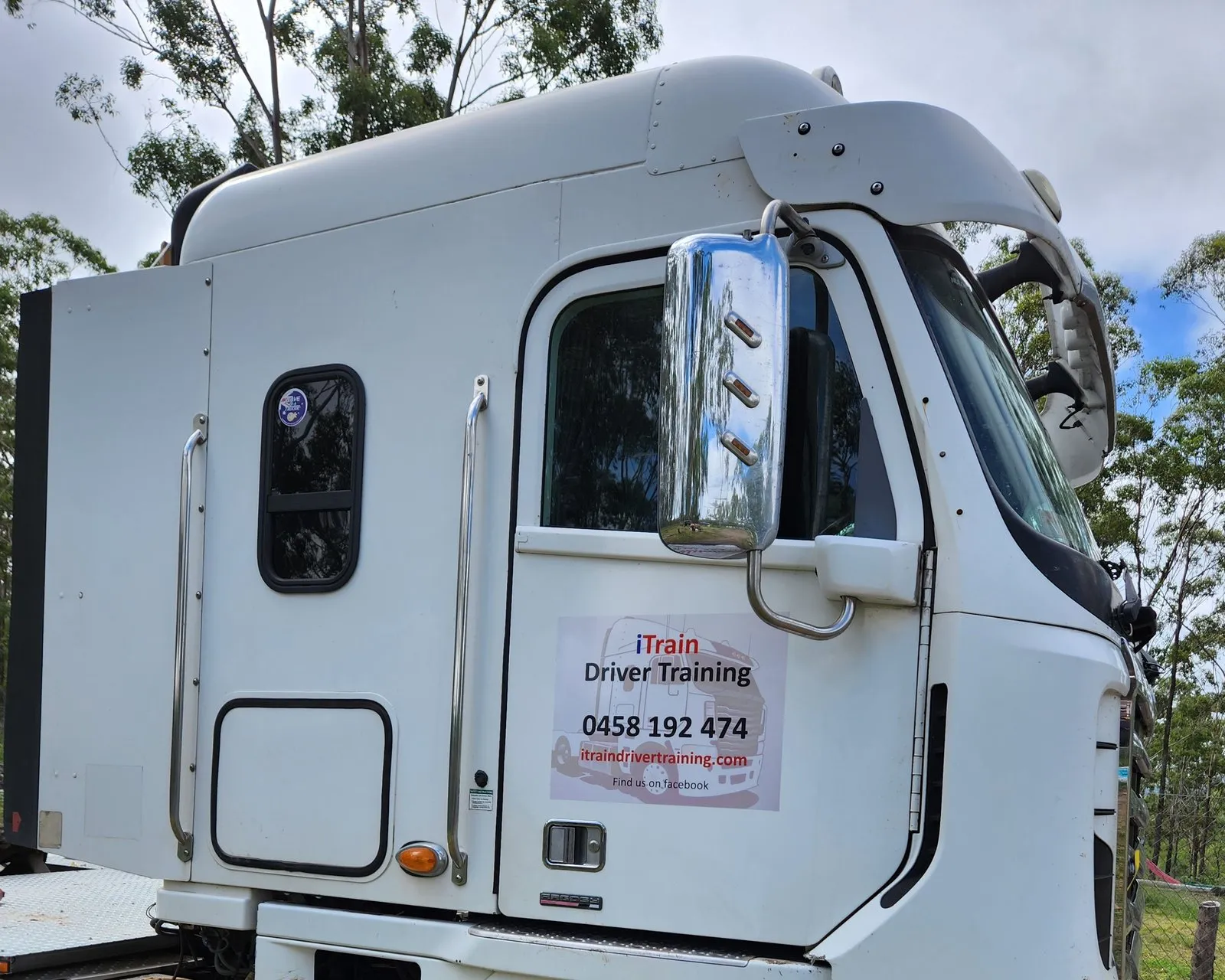iTrain's white Freightliner Argosy prime mover